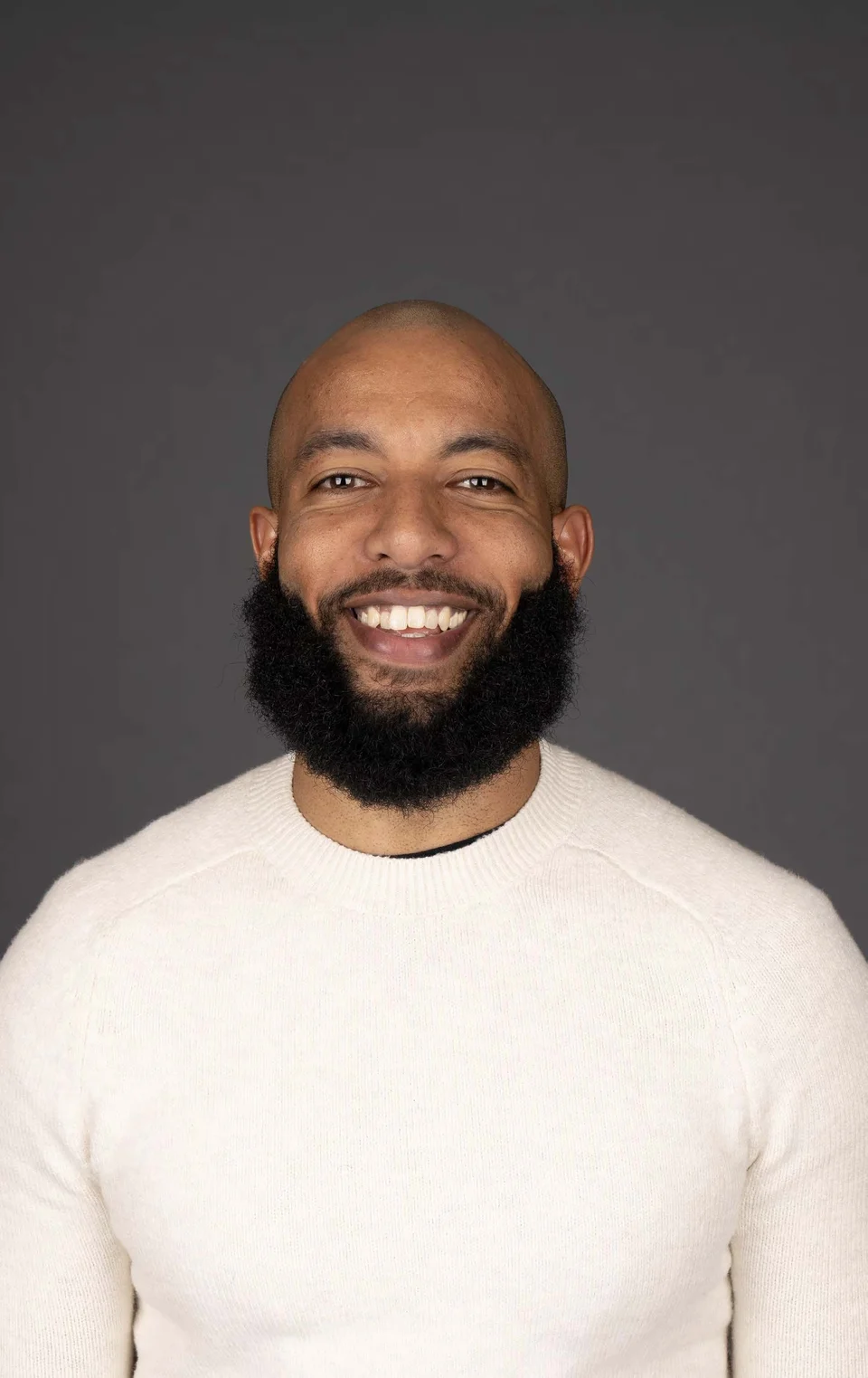 Studio portrait of Hisham Ali Bob, founder and principal of Praxis Strategy Group